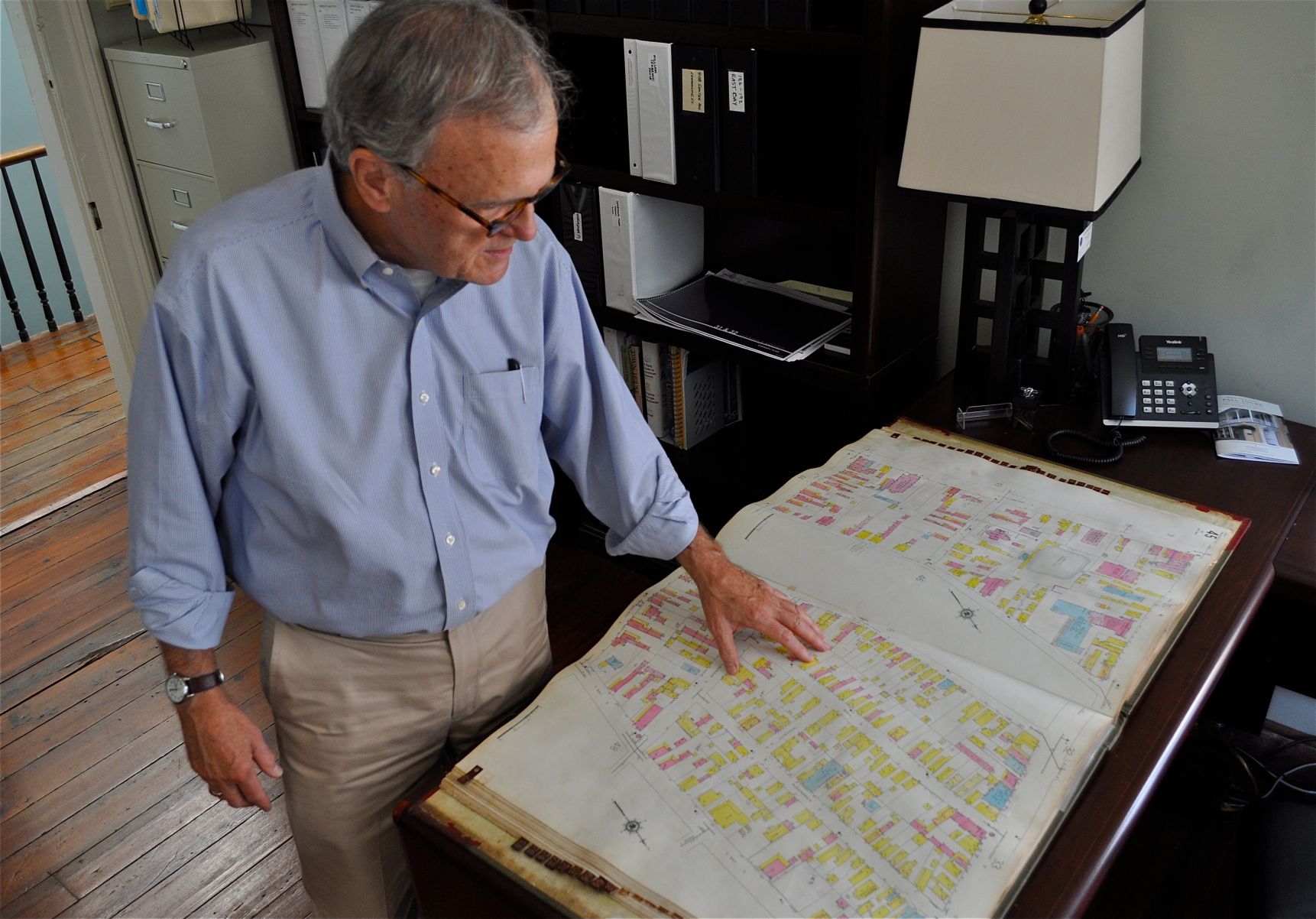 Robert Gurley looks over a Sanborn (insurance company) map at Preservation Society